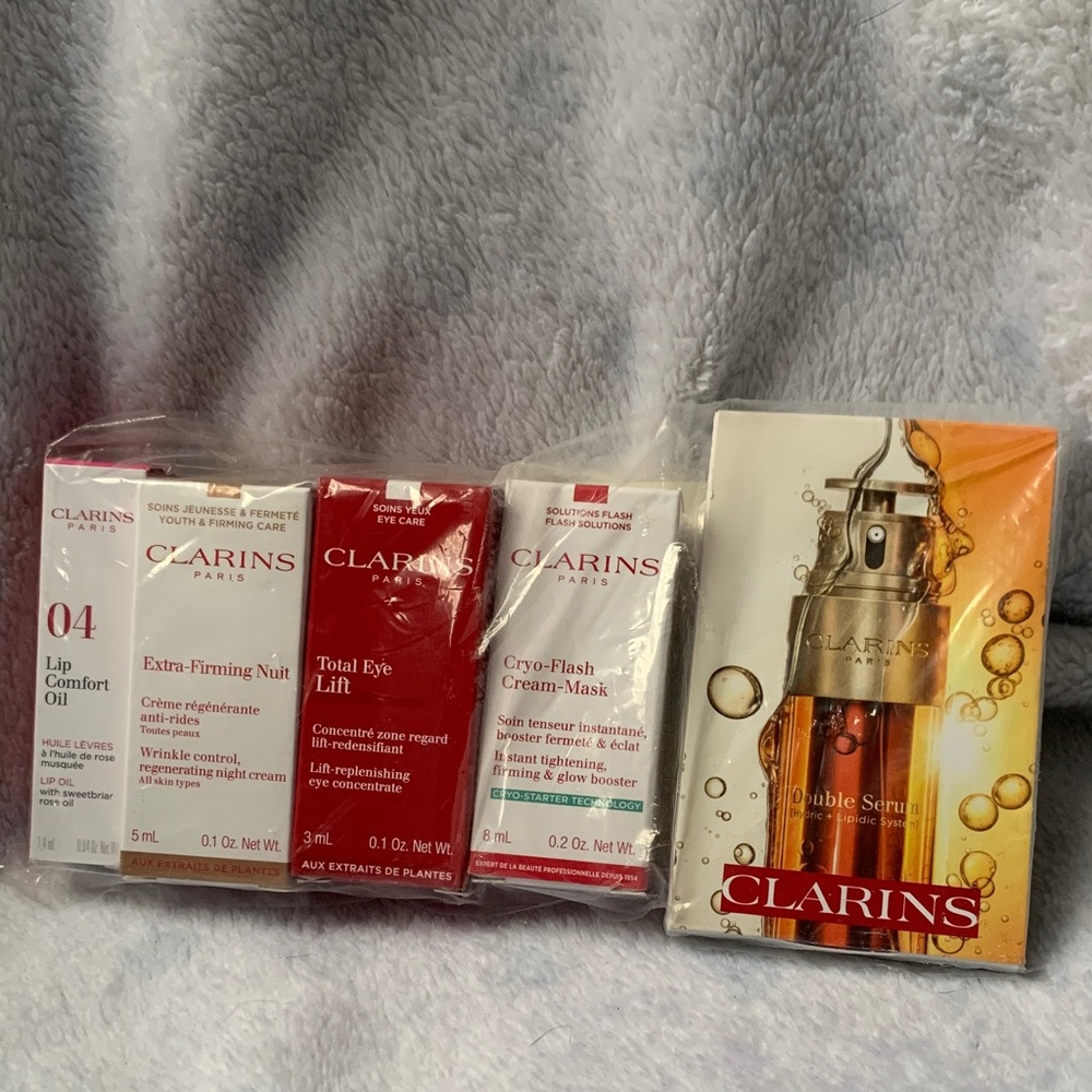 Clarins Skincare Collection with Red, White, and Gold Packaging